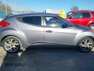 2016 Hyundai Veloster with VIN KMHTC6AD3GU283985, listed as a IAAI auction lot 41872103 with 153,949 mi miles. Bid and sale history available at carsss.com. Image 13.