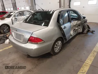 2006 Mitsubishi Lancer ES with VIN JA3AJ26E96U070354, listed as a IAAI auction lot 41572102 with 235,943 mi miles. Bid and sale history available at carsss.com. Image 4.