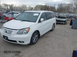 2010 Honda Odyssey Touring with VIN 5FNRL3H99AB005395, listed as a IAAI auction lot 42027445 with 181,559 mi miles. Bid and sale history available at carsss.com. Image 2.