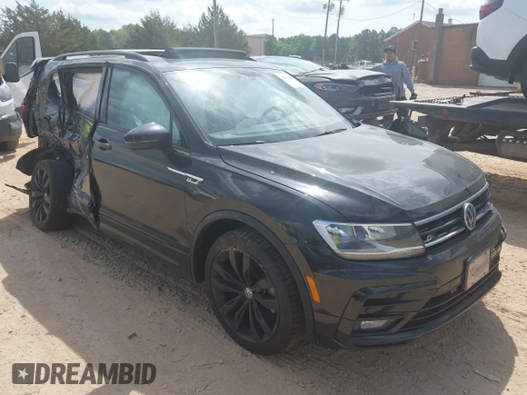 2021 Volkswagen Tiguan SE z VIN 3VV3B7AX5MM027369, wystawiony jako IAAI lot #42082821 z przebiegiem 74 024 mil mil oraz . Historia ofert i sprzedaży dostępna na DreamBid. Obrazek 1.