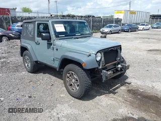 2014 Jeep Wrangler Sport with VIN 1C4AJWAG1EL303195, listed as a IAAI auction lot 42675101 with 112,334 mi miles and . Bid and sale history available at DreamBid. Image 1.