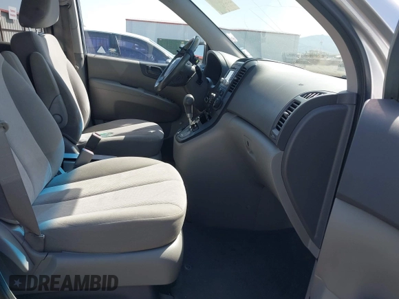 2012 Kia Sedona LX with VIN KNDMG4C70C6491703, listed as a IAAI auction lot 42128411 with 246,586 mi miles. Bid and sale history available at carsss.com. Image 5.