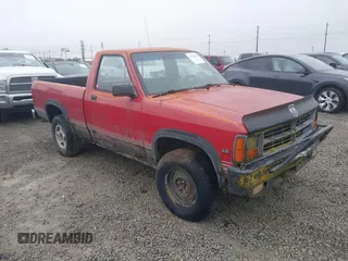 1989 Dodge Dakota z VIN 1B7GG66X9KS094016, wystawiony jako IAAI lot #41734985 z przebiegiem 156 980 mil mil oraz . Historia ofert i sprzedaży dostępna na DreamBid. Obrazek 1.