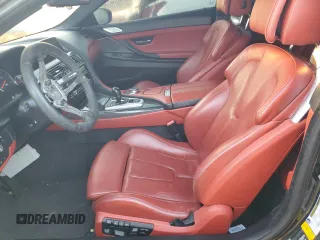 2017 BMW M6 z VIN WBS6J9C3XHD934858, wystawiony jako Copart lot #73714104 z przebiegiem Nie podano mil oraz Szkoda całkowita • Salvage title. Historia ofert i sprzedaży dostępna na DreamBid. Obrazek 7.