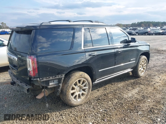 2015 GMC Yukon Denali with VIN 1GKS1CKJ8FR612971, listed as a IAAI auction lot 41519689 with 197,003 mi miles. Bid and sale history available at carsss.com. Image 4.
