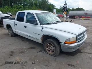 2001 Dodge Dakota Sport z VIN 1B7GL2AX11S180219, wystawiony jako IAAI lot #42292696 z przebiegiem 235 199 mil mil oraz . Historia ofert i sprzedaży dostępna na DreamBid. Obrazek 1.