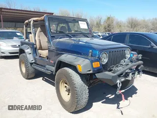 2000 Jeep Wrangler Sport with VIN 1J4FA49S0YP770943, listed as a IAAI auction lot 41817600 with 165,379 mi miles. Bid and sale history available at carsss.com. Image 1.