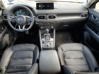 2021 Mazda CX-5 Grand Touring with VIN JM3KFBDM0M0500561, listed as a Copart auction lot 58214665 with 49,543 mi miles and Salvage title. Bid and sale history available at DreamBid. Image 8.
