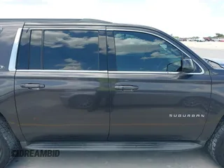 2015 Chevrolet Suburban LT z VIN 1GNSKJKC9FR245097, wystawiony jako IAAI lot #42468168 z przebiegiem 198 454 mil mil oraz . Historia ofert i sprzedaży dostępna na DreamBid. Obrazek 13.