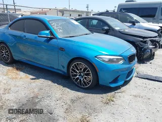 2018 BMW M2 z VIN WBS1J5C59JVE51997, wystawiony jako IAAI lot #42348421 z przebiegiem 51 376 mil mil oraz . Historia ofert i sprzedaży dostępna na DreamBid. Obrazek 1.