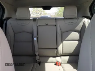 2023 Cadillac XT4 FWD Luxury with VIN 1GYAZAR46PF134602, listed as a Copart auction lot 54684865 with 13,221 mi miles and Salvage title. Bid and sale history available at DreamBid. Image 10.