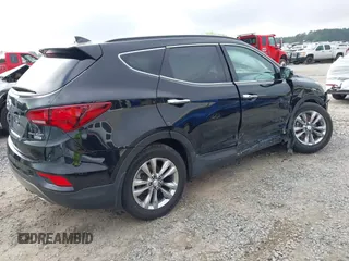 2018 Hyundai Santa Fe 2.0T z VIN 5NMZUDLA3JH057978, wystawiony jako IAAI lot #41930580 z przebiegiem 118 100 mil mil oraz . Historia ofert i sprzedaży dostępna na DreamBid. Obrazek 4.