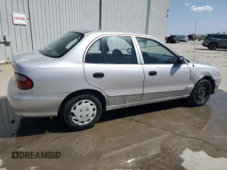 1998 Hyundai Accent z VIN KMHVF24N8WU500040, wystawiony jako Copart lot #52039755 z przebiegiem 103 631 mil mil oraz Szkody całkowita. Historia ofert i sprzedaży dostępna na DreamBid. Obrazek 3.
