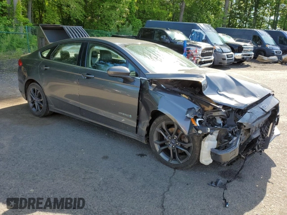 2018 Ford Fusion SE z VIN 3FA6P0LU9JR242443, wystawiony jako Copart lot #58049355 z przebiegiem 123 990 mil mil oraz Szkoda całkowita • Salvage title. Historia ofert i sprzedaży dostępna na DreamBid. Obrazek 4.