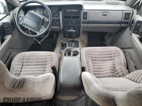1995 Jeep Grand Cherokee Laredo z VIN 1J4GZ58S2SC578183, wystawiony jako Copart lot #61665955 z przebiegiem 341 135 mil mil oraz Szkoda całkowita • Salvage title. Historia ofert i sprzedaży dostępna na DreamBid. Obrazek 8.