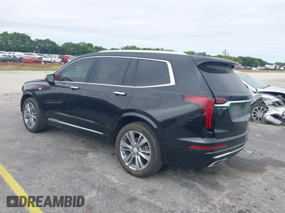 2023 Cadillac XT6 FWD Premium Luxury with VIN 1GYKPCRS6PZ106284, listed as a IAAI auction lot 41595617 with 32,795 mi miles and . Bid and sale history available at DreamBid. Image 3.