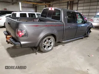 2002 Ford F-150 Harley Davidson with VIN 1FTRW07392KE05237, listed as a Copart auction lot 87451334 with 175,986 mi miles and Salvage Title. Bid and sale history available at carsss.com. Image 3.
