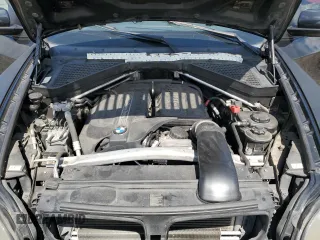 2012 BMW X5 35i with VIN 5UXZV4C54CL744502, listed as a Copart auction lot 57828115 with 161,597 mi miles and Clean title. Bid and sale history available at DreamBid. Image 12.
