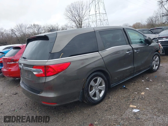 2018 Honda Odyssey EX-L with VIN 5FNRL6H72JB081086, listed as a IAAI auction lot 41031370 with 73,907 mi miles and . Bid and sale history available at DreamBid. Image 4.