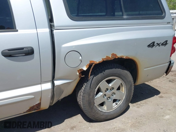 2005 Dodge Dakota SLT with VIN 1D7HW48N45S321002, listed as a IAAI auction lot 42240338 with 214,983 mi miles and . Bid and sale history available at DreamBid. Image 19.