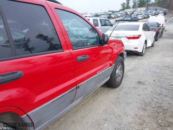 1999 Jeep Grand Cherokee Laredo with VIN 1J4GW58S0XC519908, listed as a IAAI auction lot 41789905 with 221,064 mi miles. Bid and sale history available at carsss.com. Image 12.