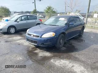 2014 Chevrolet Impala Limited Police Police with VIN 2G1WD5E34E1133735, listed as a IAAI auction lot 41573966 with 239,533 mi miles. Bid and sale history available at carsss.com. Image 2.