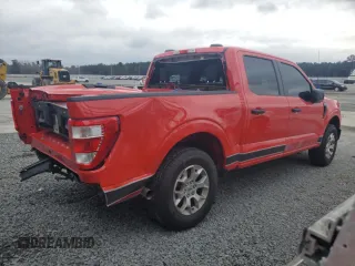 2023 Ford F-150 with VIN 1FTFW1P85PKD82406, listed as a Copart auction lot 84744944 with 32,982 mi miles and Salvage title. Bid and sale history available at DreamBid. Image 3.