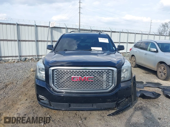 2015 GMC Yukon Denali with VIN 1GKS1CKJ8FR612971, listed as a IAAI auction lot 41519689 with 197,003 mi miles. Bid and sale history available at carsss.com. Image 12.