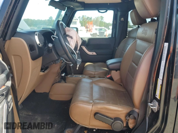 2012 Jeep Wrangler Unlimited Sahara with VIN 1C4HJWEG5CL205826, listed as a Copart auction lot 58222115 with 98,940 mi miles and Salvage title. Bid and sale history available at DreamBid. Image 7.