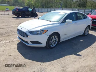 2017 Ford Fusion Hybrid SE z VIN 3FA6P0LU8HR396572, wystawiony jako IAAI lot #41997684 z przebiegiem 272 803 mil mil oraz . Historia ofert i sprzedaży dostępna na DreamBid. Obrazek 17.