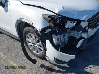 2016 Mazda CX-5 Sport with VIN JM3KE2BY9G0879654, listed as a IAAI auction lot 41819154 with 65,586 mi miles. Bid and sale history available at carsss.com. Image 6.