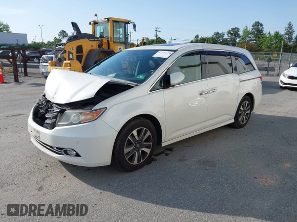 2014 Honda Odyssey Touring with VIN 5FNRL5H94EB001479, listed as a IAAI auction lot 41123678 with 147,269 mi miles and . Bid and sale history available at carsss.com. Image 2.