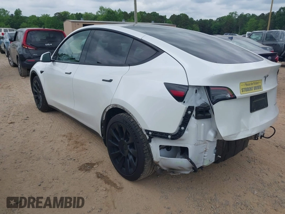 2021 Tesla Model Y Long Range with VIN 5YJYGDEE7MF198867, listed as a IAAI auction lot 42117463 with 79,759 mi miles and . Bid and sale history available at DreamBid. Image 3.