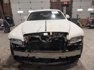 2014 Rolls-Royce Wraith with VIN SCA665C59EUX84389, listed as a IAAI auction lot 41413368 with 57,951 mi miles. Bid and sale history available at carsss.com. Image 13.