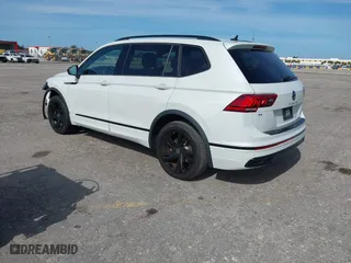 2023 Volkswagen Tiguan SE R-Line Black with VIN 3VVCB7AX0PM090710, listed as a IAAI auction lot 41256904 with 12,819 mi miles. Bid and sale history available at carsss.com. Image 3.