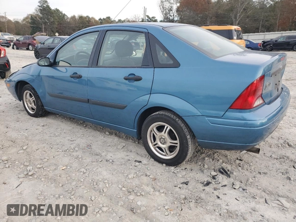 2001 Ford Focus LX with VIN 1FAHP33P01W332260, listed as a Copart auction lot 83221654 with 104,028 mi miles and Salvage Title. Bid and sale history available at DreamBid. Image 2.