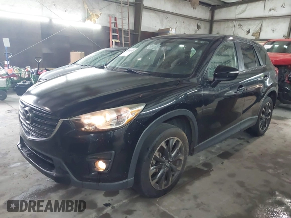 2016 Mazda CX-5 Grand Touring with VIN JM3KE4DY5G0816575, listed as a IAAI auction lot 42101340 with 180,762 mi miles and . Bid and sale history available at carsss.com. Image 19.
