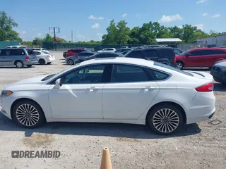 2018 Ford Fusion Titanium with VIN 3FA6P0D98JR134230, listed as a IAAI auction lot 42567084 with 107,459 mi miles and . Bid and sale history available at DreamBid. Image 14.