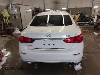2015 Infiniti Q50 Premium z VIN JN1BV7AR0FM417283, wystawiony jako IAAI lot #41579549 z przebiegiem 112 407 mil mil oraz . Historia ofert i sprzedaży dostępna na DreamBid. Obrazek 17.