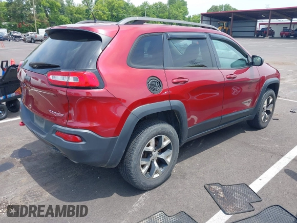 2014 Jeep Cherokee Trailhawk with VIN 1C4PJMBS7EW162357, listed as a IAAI auction lot 42601903 with 104,768 mi miles and . Bid and sale history available at DreamBid. Image 4.