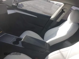 2023 Tesla Model 3 Performance z VIN 5YJ3E1EC5PF689620, wystawiony jako IAAI lot #41814112 z przebiegiem Nie podano mil oraz . Historia ofert i sprzedaży dostępna na DreamBid. Obrazek 17.
