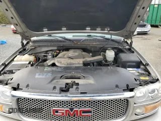 2005 GMC Yukon Denali z VIN 1GKEK63U65J262371, wystawiony jako Copart lot #52773425 z przebiegiem 129 028 mil mil oraz Czysty tytuł • Clean title. Historia ofert i sprzedaży dostępna na DreamBid. Obrazek 12.