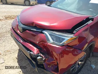 2018 Toyota RAV4 XLE with VIN 2T3WFREVXJW434957, listed as a IAAI auction lot 42002561 with 111,590 mi miles and . Bid and sale history available at carsss.com. Image 6.