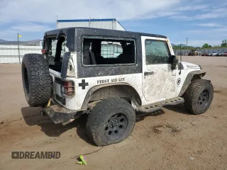 2016 Jeep Wrangler Willys Wheeler z VIN 1C4AJWAG4GL243285, wystawiony jako Copart lot #58035425 z przebiegiem 100 251 mil mil oraz Szkoda całkowita • Salvage title. Historia ofert i sprzedaży dostępna na DreamBid. Obrazek 3.