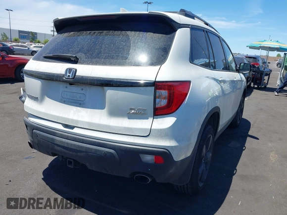 2019 Honda Passport Elite z VIN 5FNYF8H05KB009575, wystawiony jako IAAI lot #42804678 z przebiegiem 70 468 mil mil oraz . Historia ofert i sprzedaży dostępna na DreamBid. Obrazek 4.