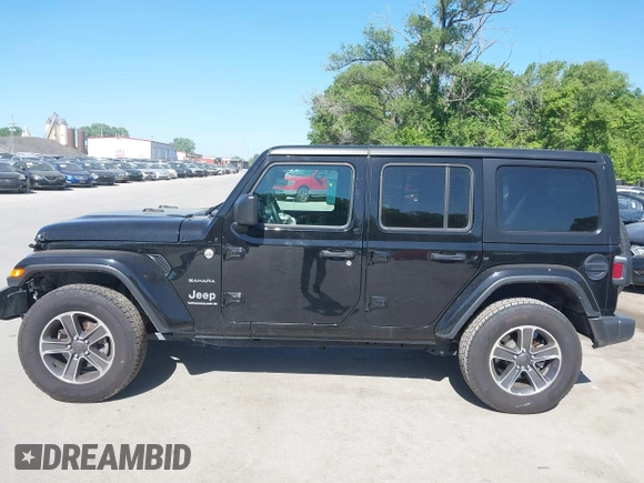2023 Jeep Wrangler Sahara with VIN 1C4HJXEN5PW702268, listed as a IAAI auction lot 42288704 with 57,240 mi miles and . Bid and sale history available at DreamBid. Image 14.