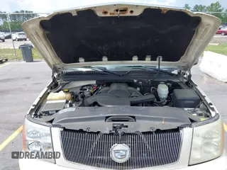 2005 Cadillac Escalade z VIN 1GYEK63N55R123817, wystawiony jako IAAI lot #42263549 z przebiegiem 297 279 mil mil oraz . Historia ofert i sprzedaży dostępna na DreamBid. Obrazek 10.