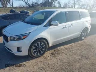 2015 Kia Sedona EX with VIN KNDMC5C12F6034991, listed as a IAAI auction lot 41971340 with 148,231 mi miles. Bid and sale history available at carsss.com. Image 2.