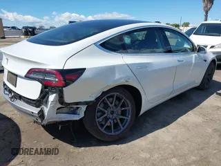 2020 Tesla Model 3 Standard Range Plus with VIN 5YJ3E1EA4LF644967, listed as a IAAI auction lot 41745984 with 23,479 mi miles and . Bid and sale history available at DreamBid. Image 4.