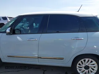 2014 FIAT 500L Lounge with VIN ZFBCFACH4EZ029817, listed as a IAAI auction lot 41909849 with 113,056 mi miles and . Bid and sale history available at DreamBid. Image 14.